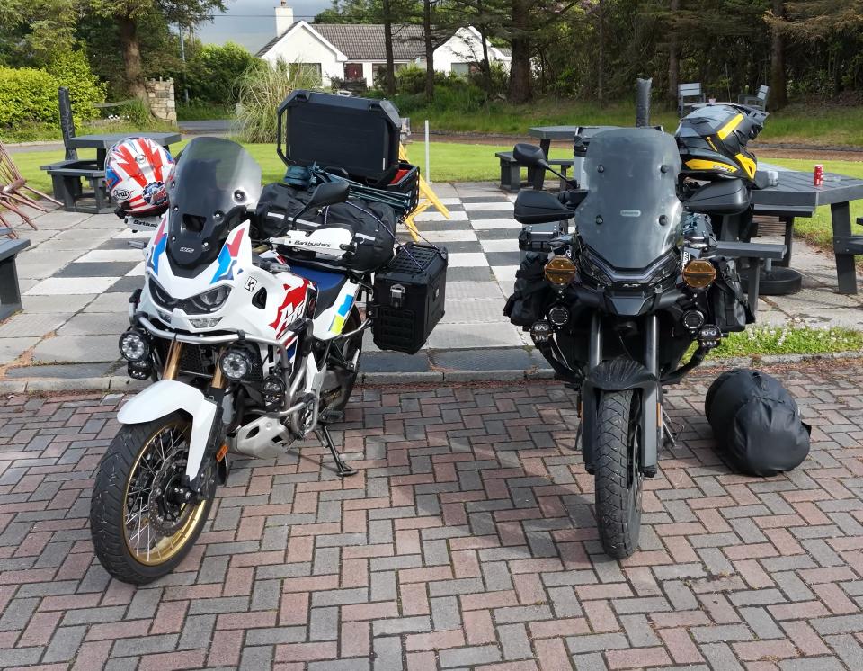 Two adventure bikes fitted with Future Eyes auxiliary lights, parked in Ireland